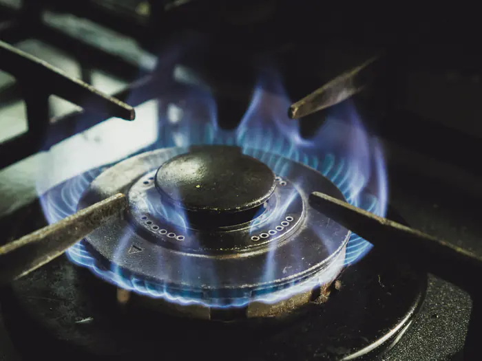 Blue flame on a gas cooktop burner